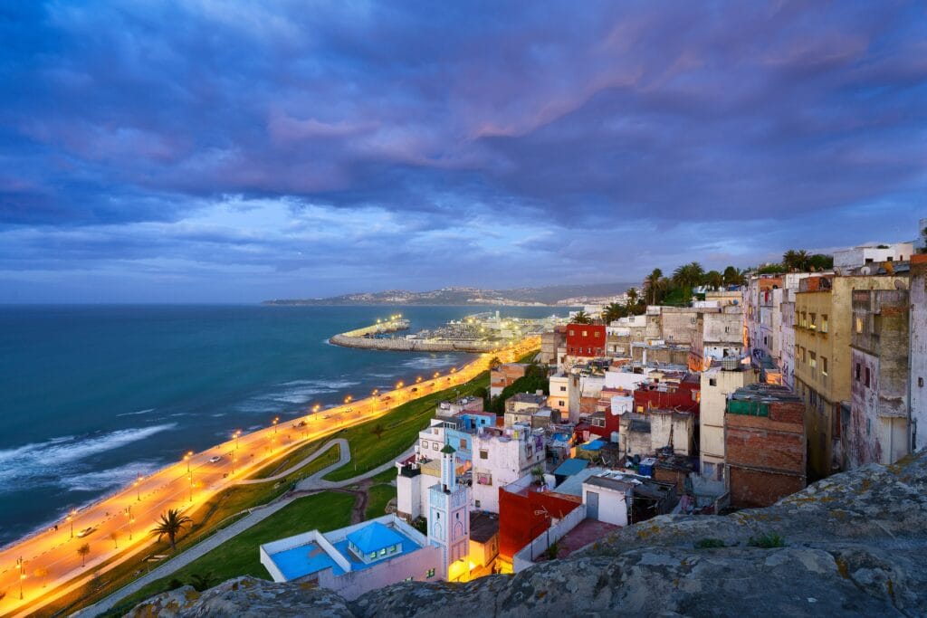 An aerial view of cityscape Tangier surrounded by buildings and water , North of Morocco