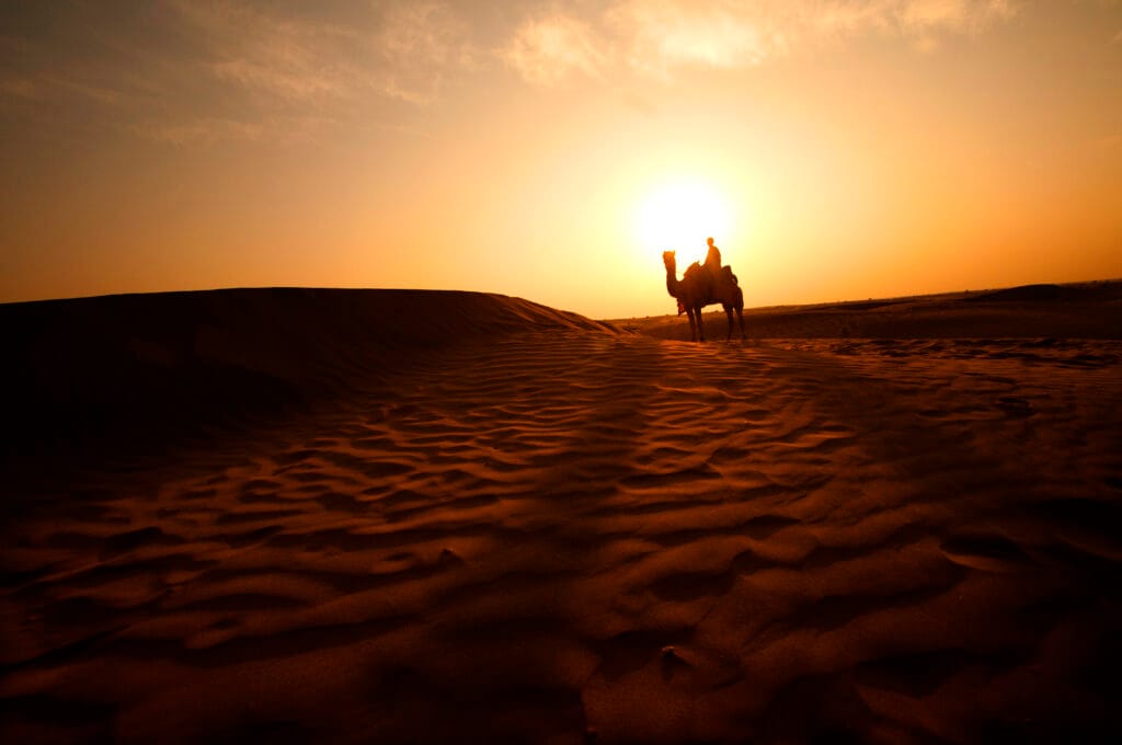 the beautiful sunset in the Desert of Merzouga in Morocco