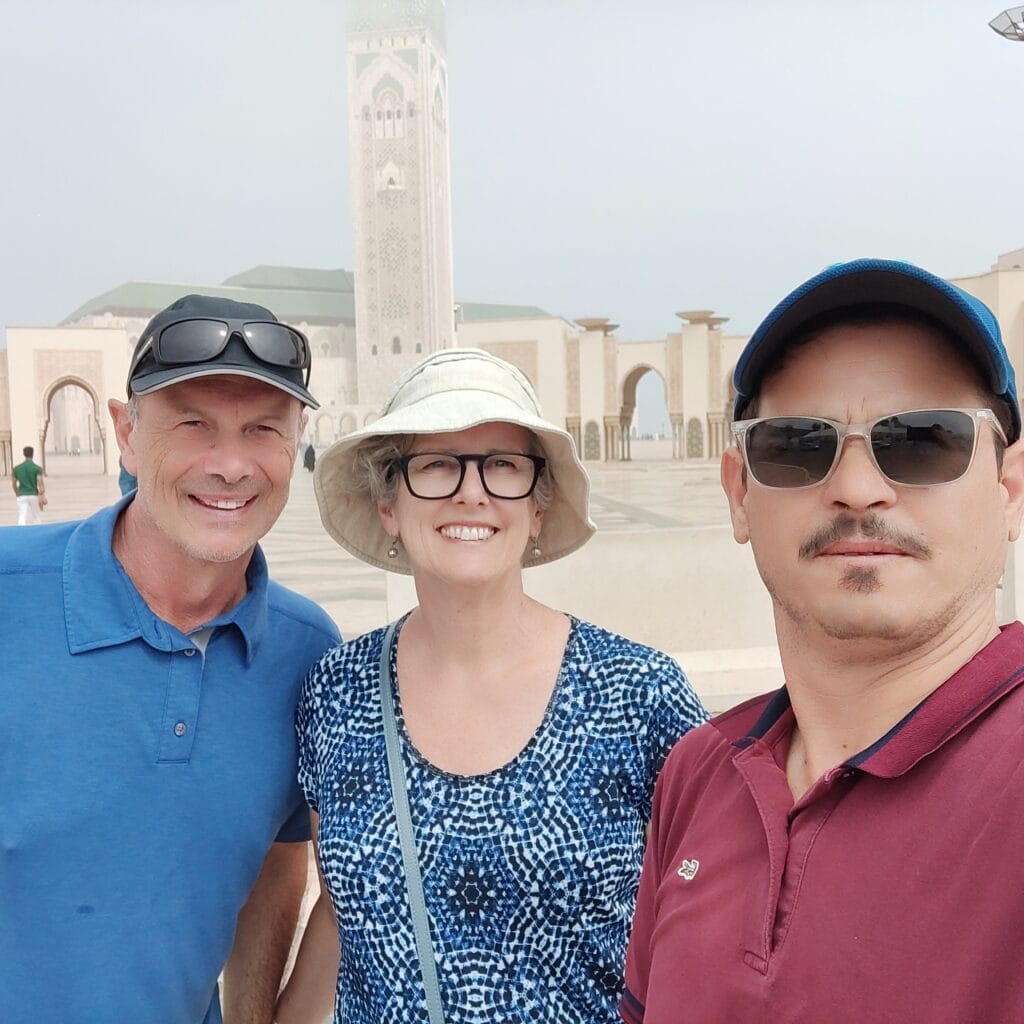 Tourists and local guide during a Casablanca city tour near Hassan II Mosque, Morocco